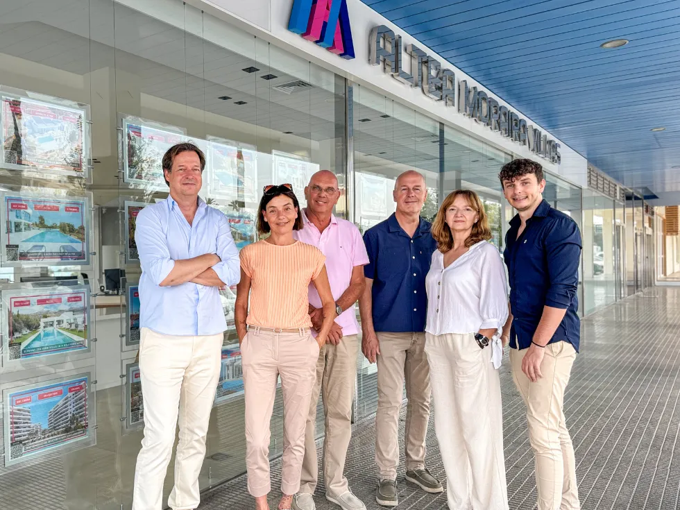 Team standing outside the Altea Moraira Villas office on Calle la Mar, Altea, with agency signage and window displays
