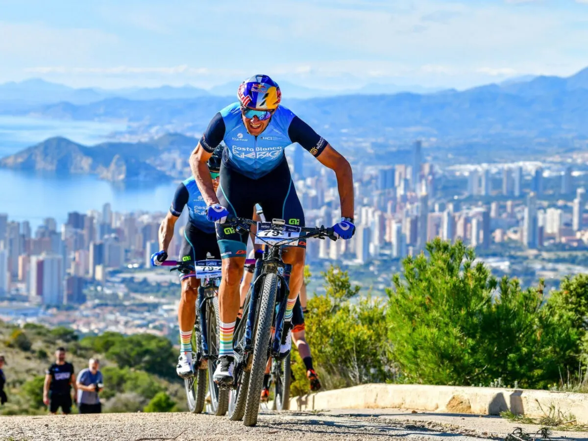 MTB race atop the cumbre del sol peak with Calpe's skyline on the background