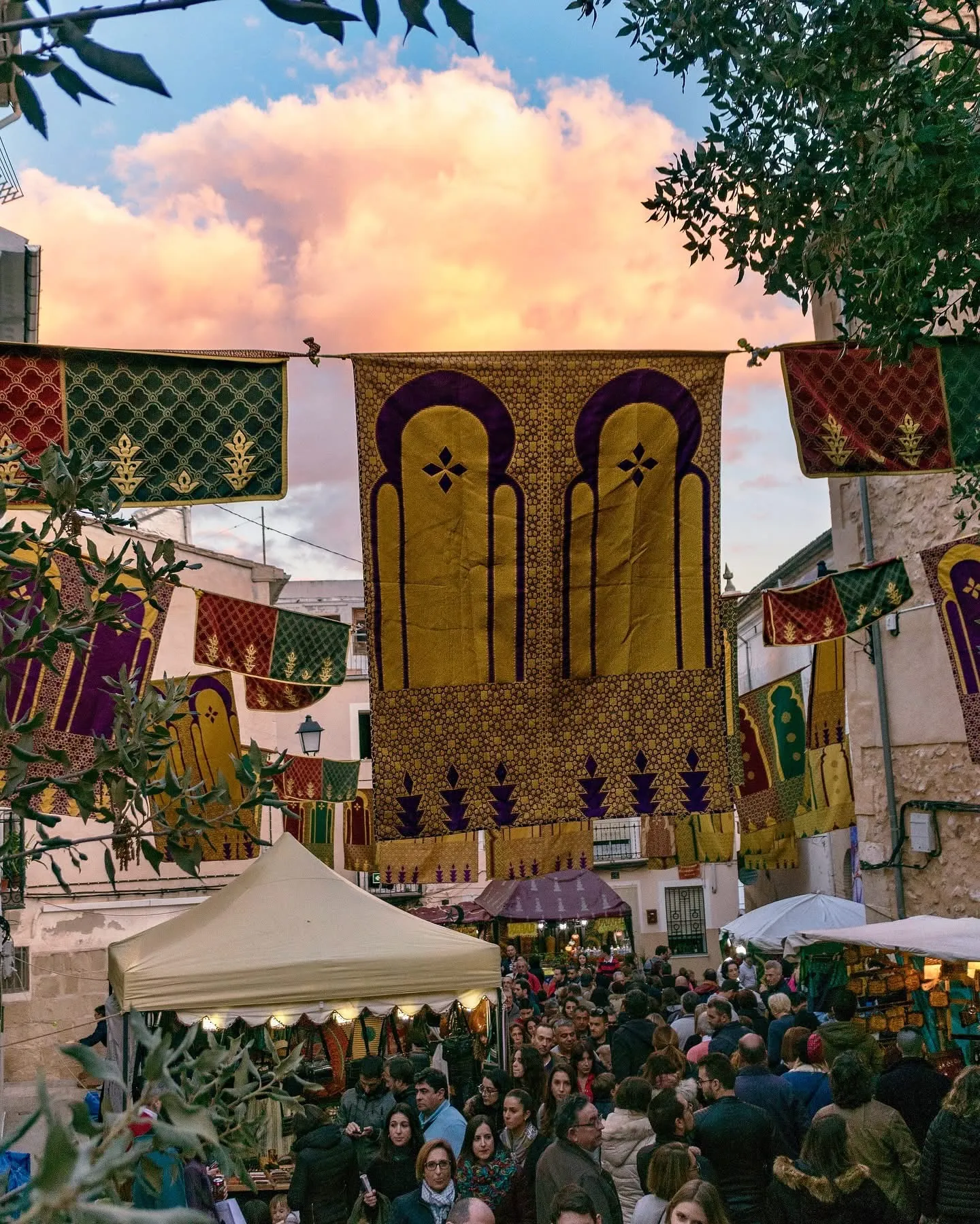 Sunset Over the Arabic Souk at the Fira de Tots Sants Ornate Arabic fabrics and lanterns decorate the streets of Cocentaina at sunset during the Fira de Tots Sants.