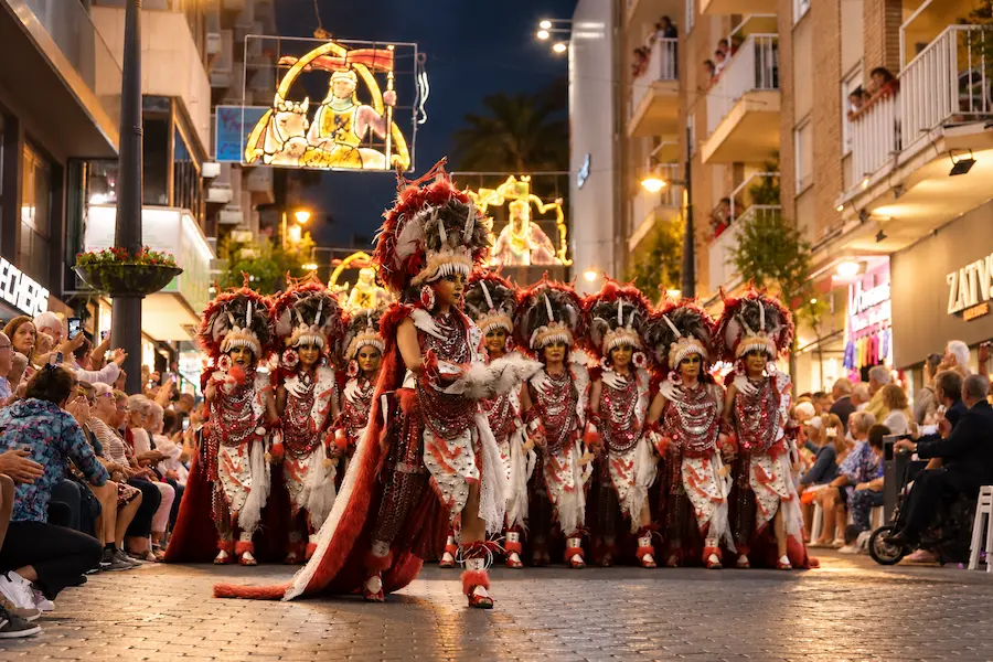 Costumed filaes parading through Benidorm's old town during the Moros y Cristianos fiesta